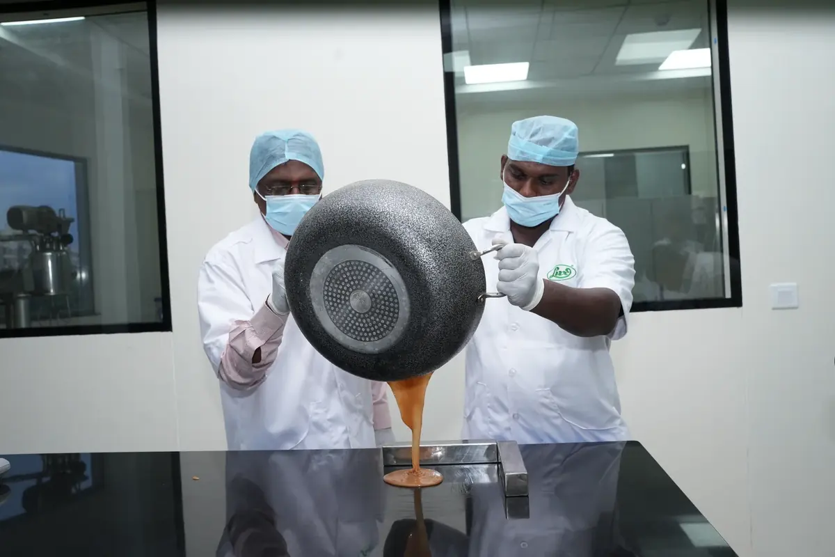 Lux application scientists pouring a toffee trial batch
