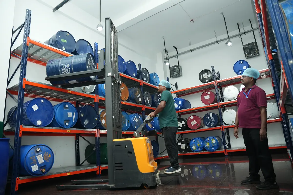 Approved raw material drums on racking at the Lux Chennai facility